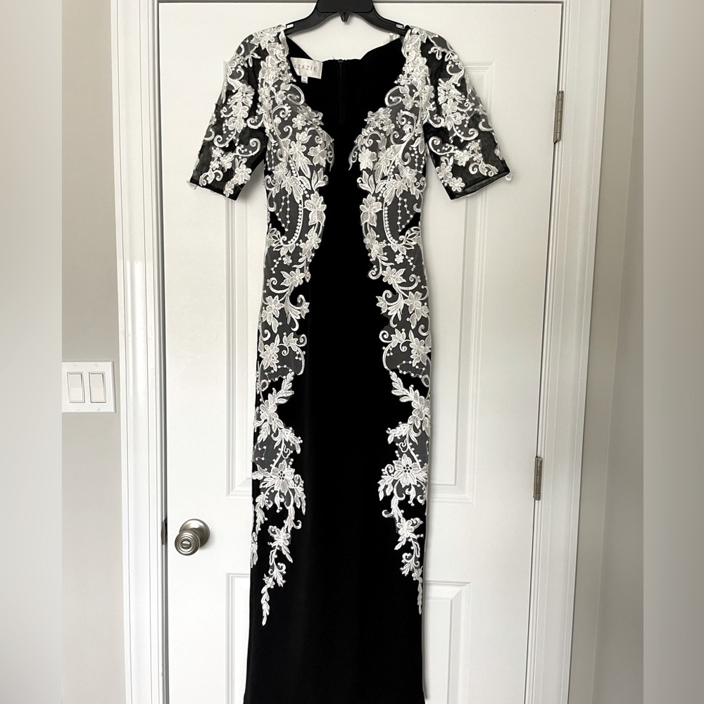 Azazie black formal long dress. White lace detail on the sides.